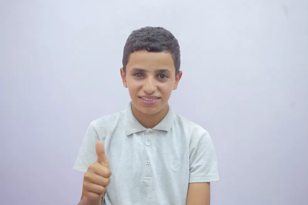 Mohamed: A boy who lost everything, but still found a reason to smile.